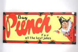 A vintage wooden Punch sign.
