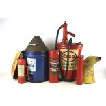 An assortment of vintage Petrol cans and fire extinguishers.