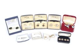 A 9ct gold pin and an assortment of boxed pairs of cufflinks.
