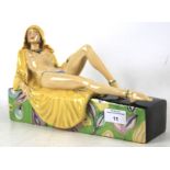 A Peggy Davis limited edition porcelain figure of a nude female.