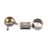 A Victorian silver floral embossed small cauldron-shaped salt, a napkin ring and match box cover.