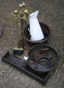 An assortment of vintage metalware. Including a large copper pan, fire irons, etc.