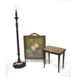 A wooden standard lamp, small mahogany table and a fire screen.