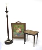 A wooden standard lamp, small mahogany table and a fire screen.