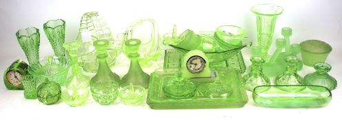 A large collection of Art Deco style pressed uranium green glassware.