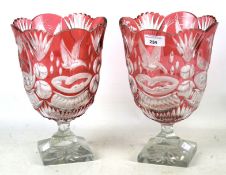 A pair of cranberry glass vases.