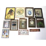 A large assortment of mirrored pictures, prints and advertising signs.