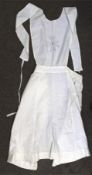 A vintage WWII cotton 'The Mornington' St Johns nurses apron. 103cm long from hem to chest.