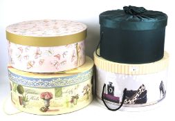 Four contemporary cardboard hat boxes.