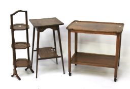 A 20th century tea trolley, folding cake stand and an oak side table.
