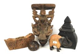 Five carved wooden items.