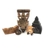 Five carved wooden items.