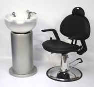 A hairdresser's ceramic sink and a hydraulic armchair.