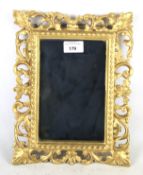 A small gilt framed wall mirror.