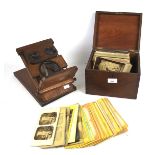 A Victorian table top stereoscopic viewer and an assortment of photographica.