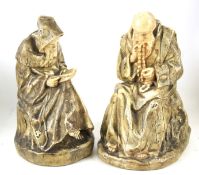 Two 20th century painted plaster figures of monks.
