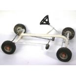 A vintage toy pedal car.