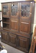 A stained oak display cabinet.