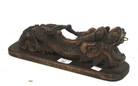 A contemporary carved wooden dragon.