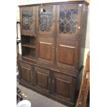 A stained oak display cabinet.