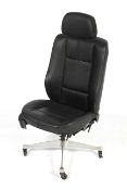A BMW black leather chair on a Herman Miller swivel base.