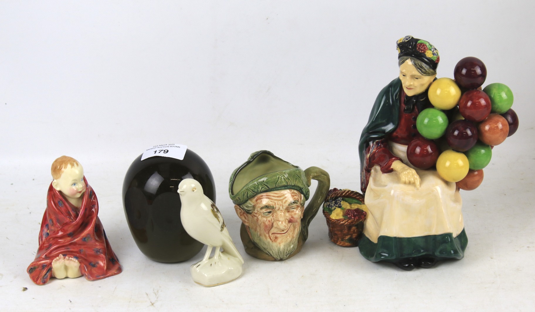 Three Doulton figures.