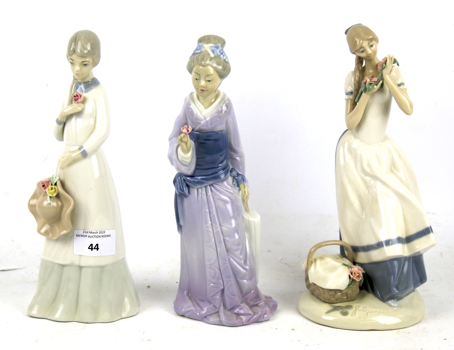 A group of three contemporary Spanish porcelain female figures. Max.