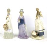 A group of three contemporary Spanish porcelain female figures. Max.
