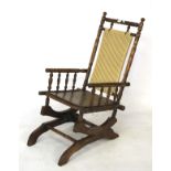 Early 20th century American beech framed rocking chair.