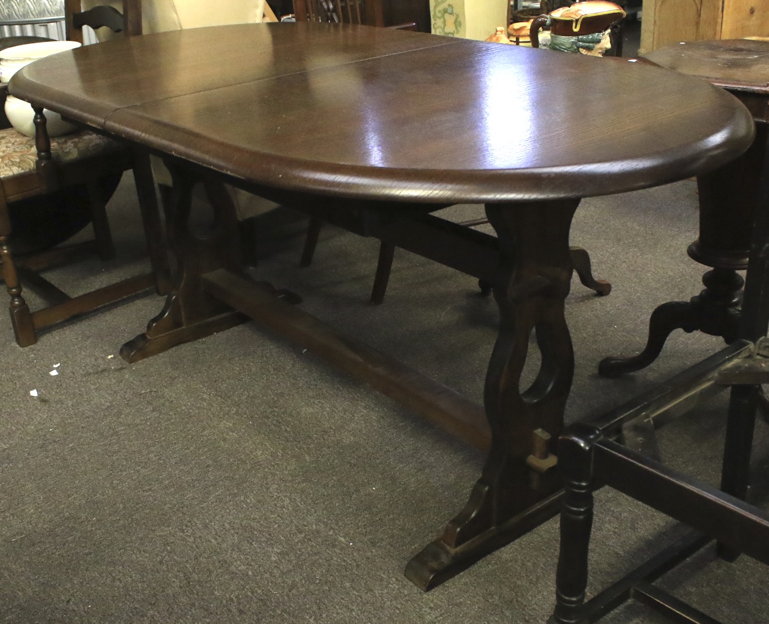 An oak extending dining table and six chairs. One chair missing a seat. - Image 2 of 3