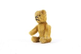 An early 20th century miniature teddy bear compact/lipstick holder, possibly by Schuco.