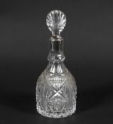 A cut glass silver mounted decanter and stopper.