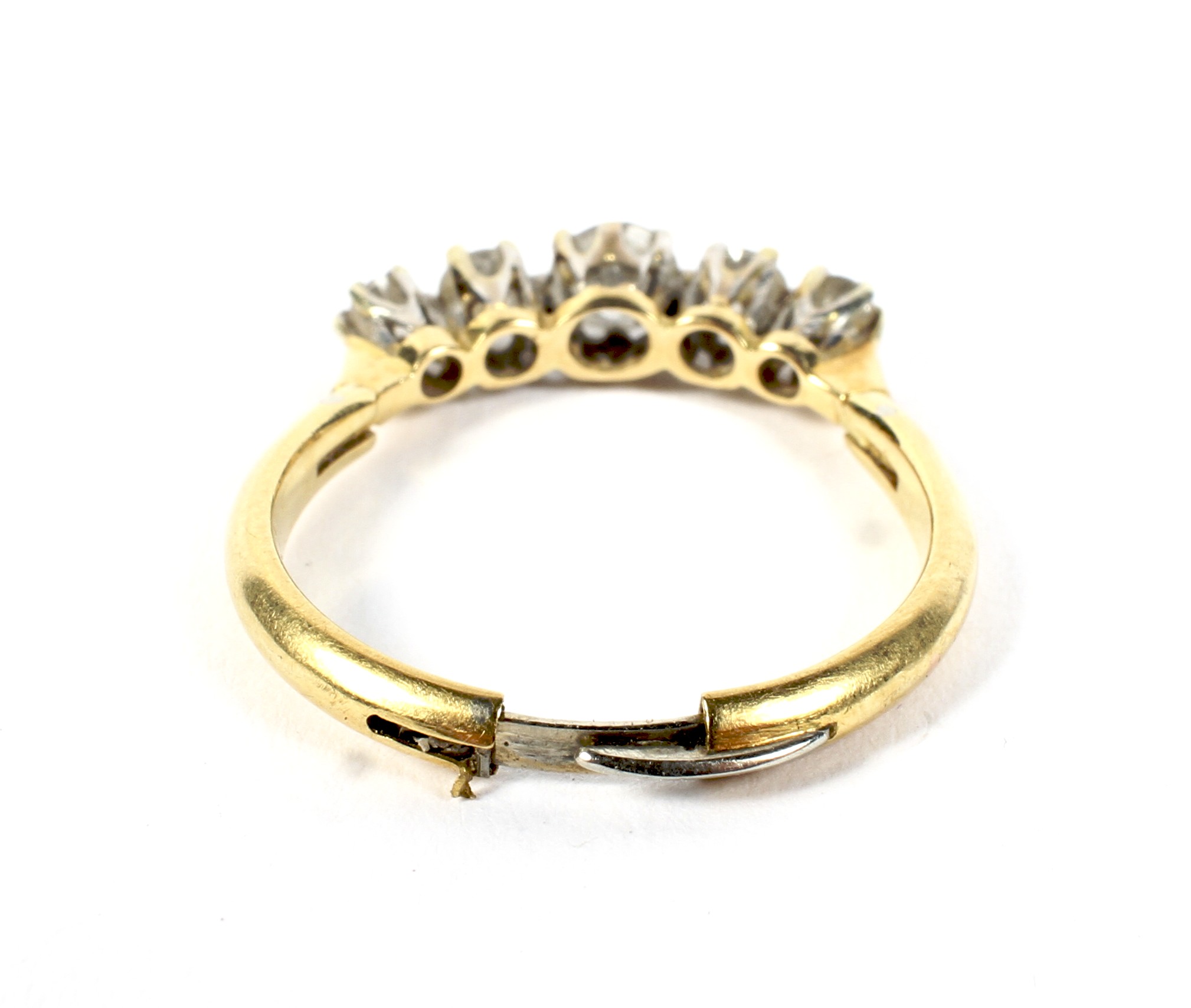 A vintage gold and diamond five stone ring. The graduated early modern-round-brilliants approx. 0. - Image 4 of 4