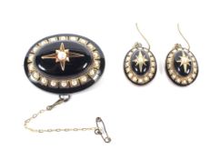 A Victorian black onyx, enamel and half-pearl oval mourning brooch and earring set.