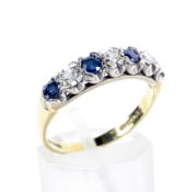 A vintage 18ct gold, sapphire and diamond seven stone ring.
