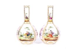 A pair of late 19th century Dresden porcelain bottle-shaped vases.