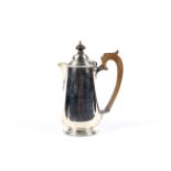 A silver coffee pot in George III style.