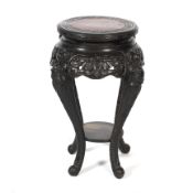 An early 20th century ebonised chinoiserie plant stand. Retailed by J Hunter & Co.