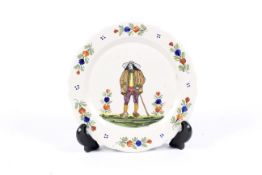 A French faience plate in the Quimper style, late 19th century.