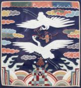 A 20th century Chinese silk framed panel in the style of a rank badge.