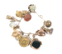 A vintage gold fancy fetter-link 'charm' bracelet by Alabaster and Wilson.