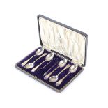 A set of six silver teaspoons and a pair of sugar nips, in a case.