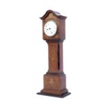 An early 20th century small oak cased marquetry inlaid mantel clock in shape of a longcase.