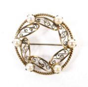 A vintage '12Kt' gold-filled and cultured-pearl six stone open circlet brooch.