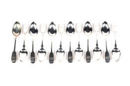 A set of twelve English provincial silver fiddle pattern teaspoons.