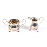 A silver baluster cream jug and a sugar bowl.