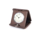 A vintage John Nix folding travel clock.