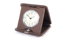 A vintage John Nix folding travel clock.