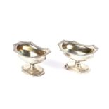 A pair of George III silver shaped-rectangular pedestal salts.