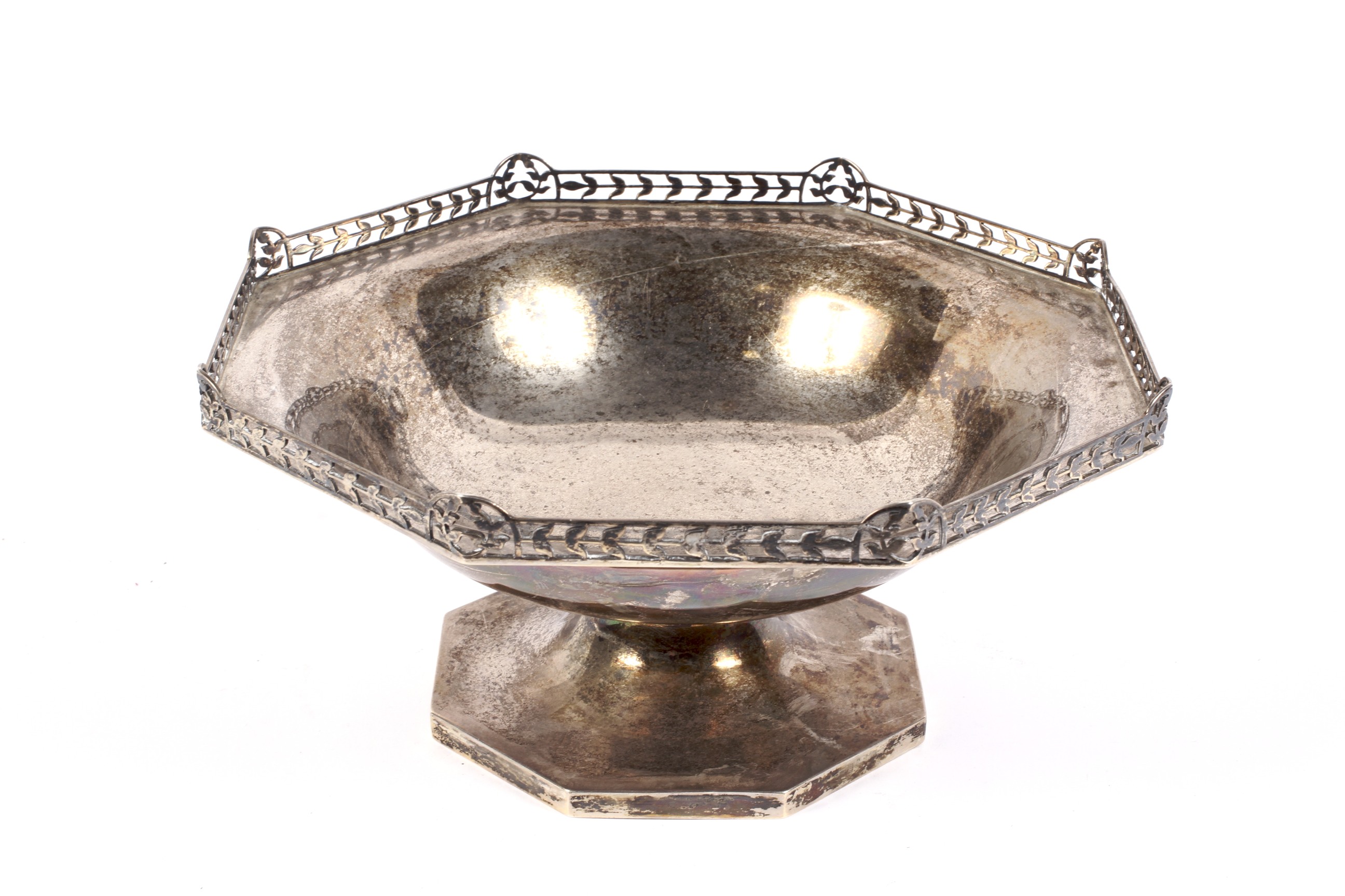 A silver octagonal pedestal fruit bowl.